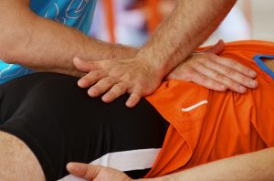 Sports Massage - Therapists Massaging Lower Back