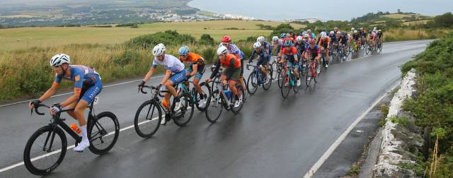 Image Showing VBicycle Riders In Action In A Rainy Day