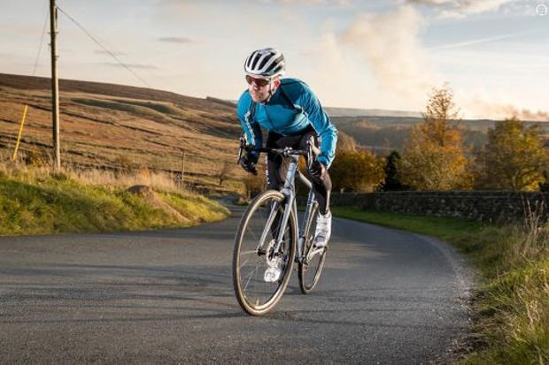 A Bicycle Racer Ride on Bike on the road