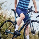 A Man Standing With His Bicycle
