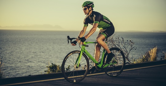 A Man Riding Bicycle in a sea background